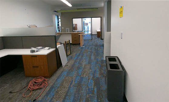 There is a trash can in the middle of the room.