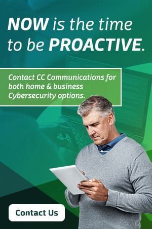 A man is holding a tablet and looking at it.