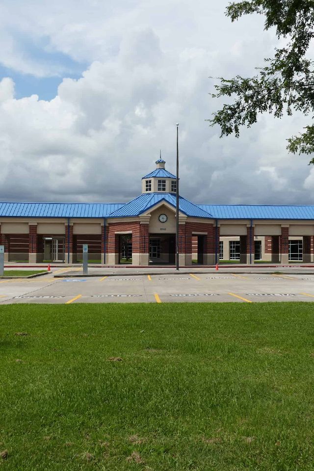 a large brick building with a blue roof