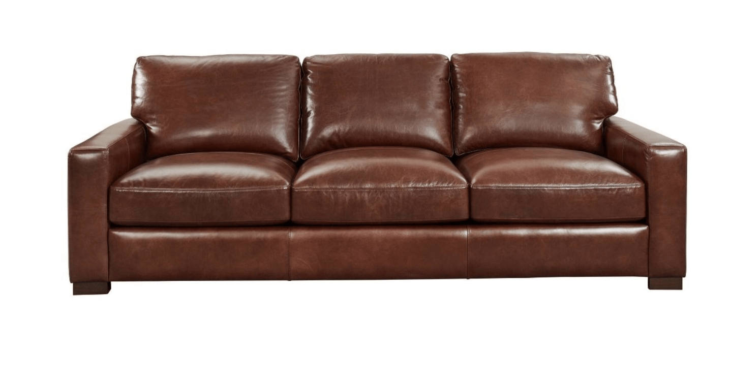 a brown leather couch on a white background