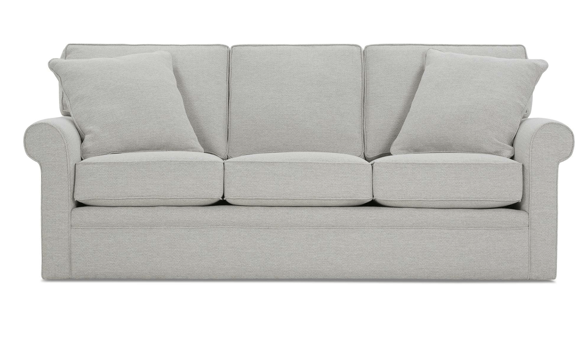 a grey couch with three pillows on a white background .