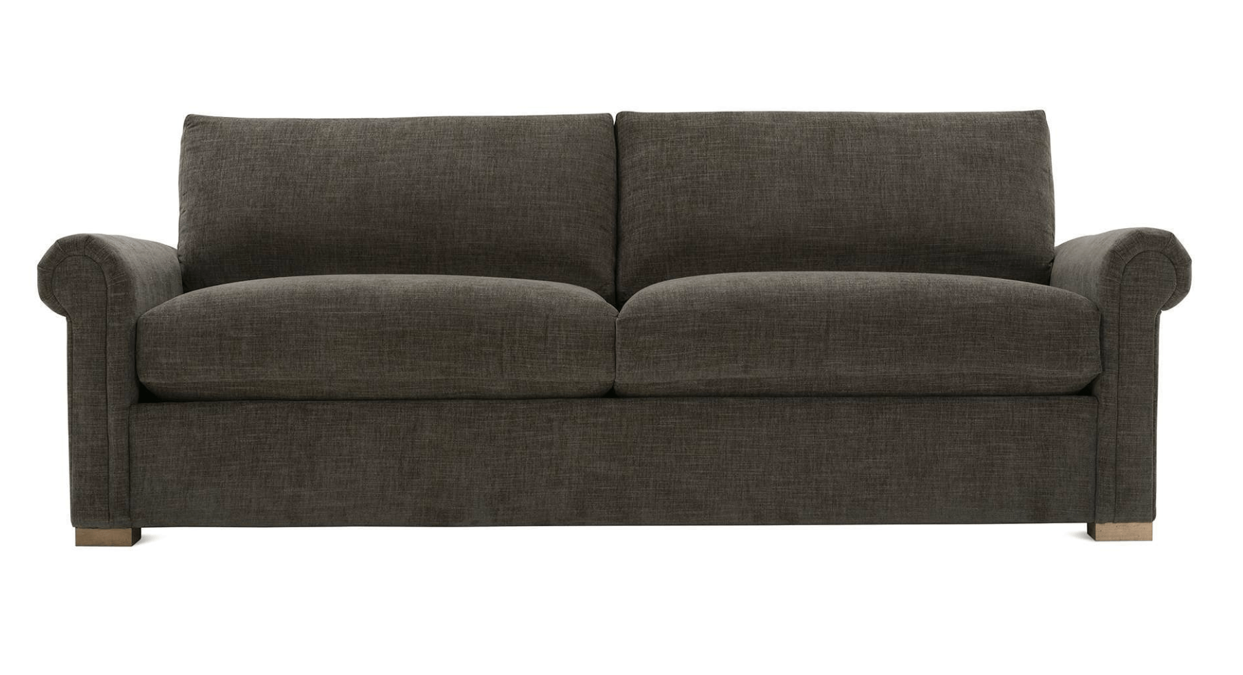 a brown couch is sitting on a white background .