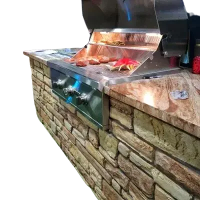 Outdoor grill built into a stone structure, with steaks cooking.