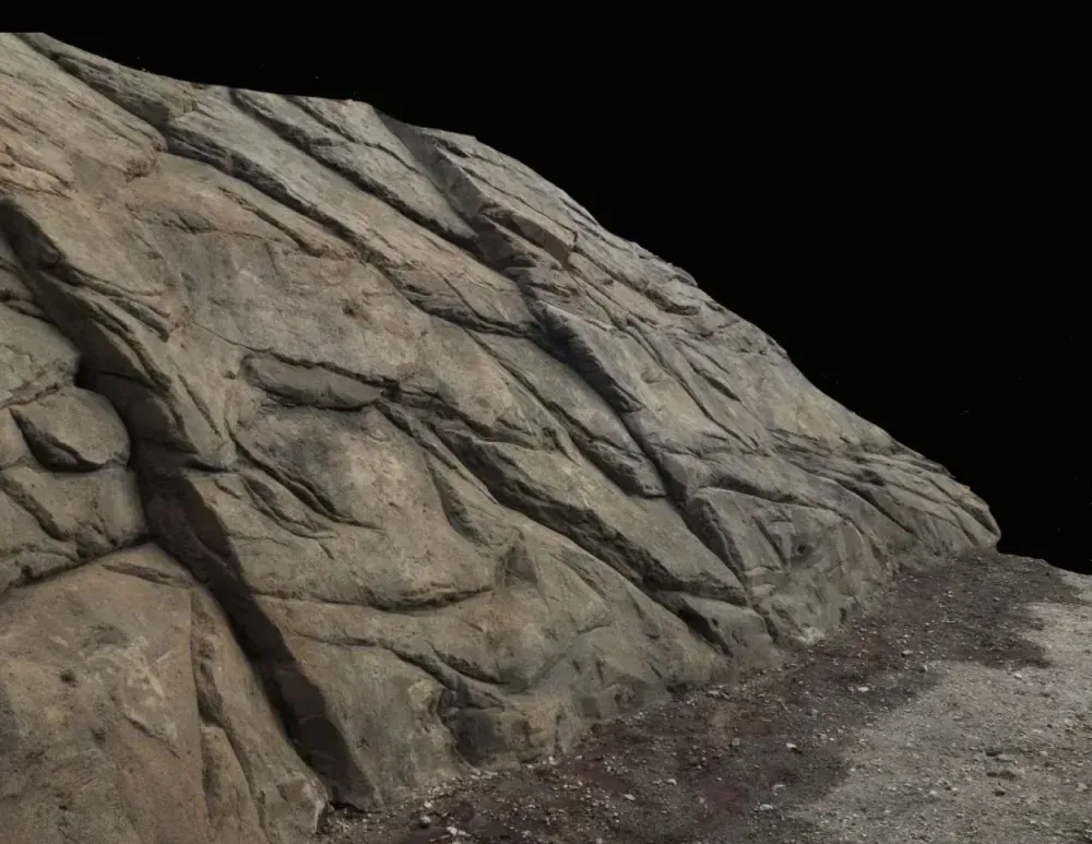 Stone cliff face with rough, angled surfaces. Light brown and gray hues.