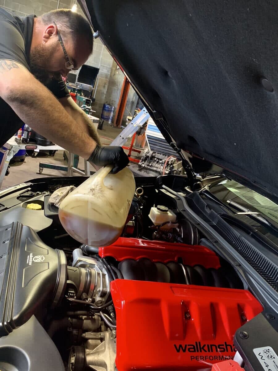 Mechanic Changing Car Oil — Joe’s Auto Service Centre in Forster, NSW