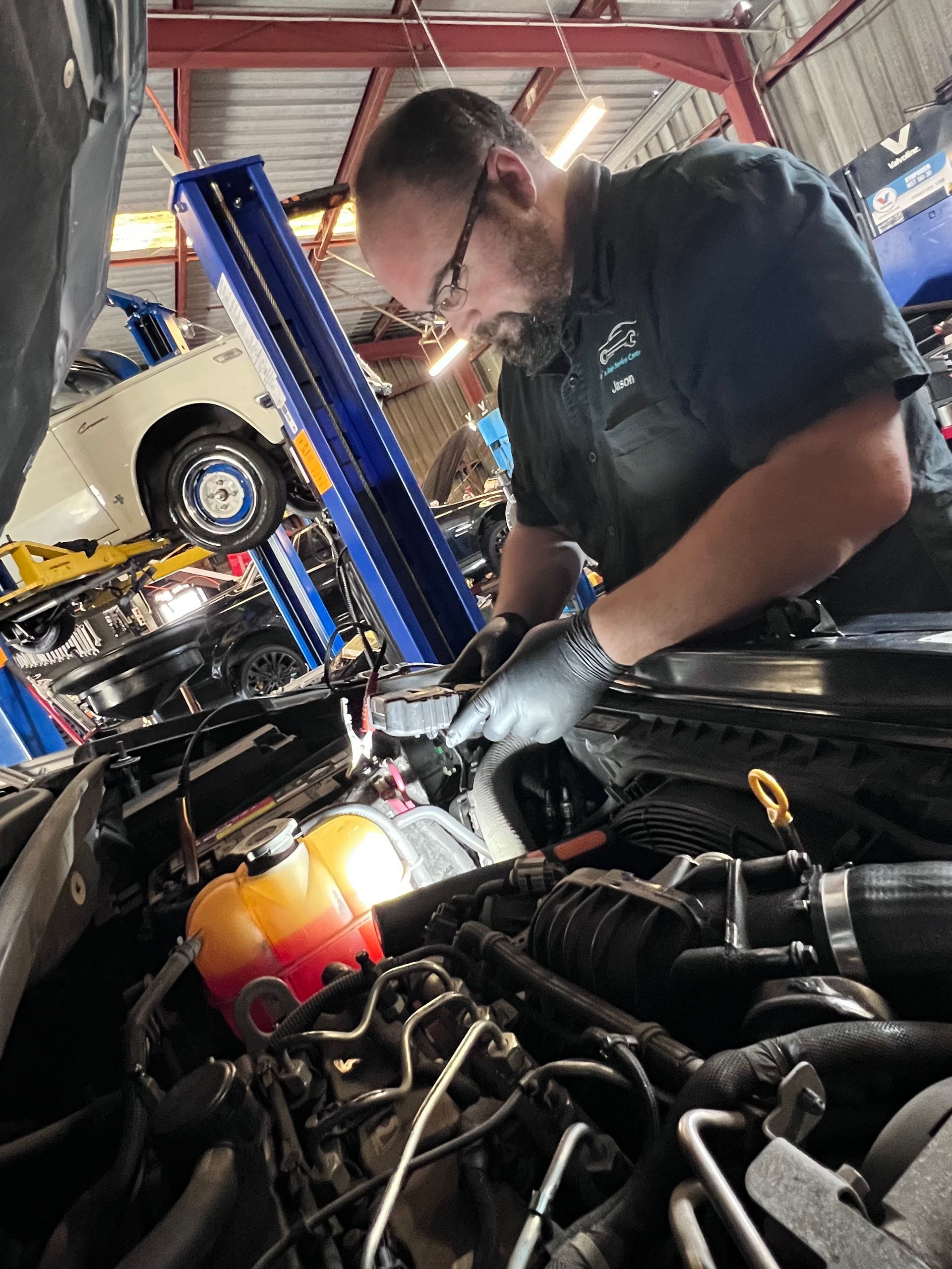 Mechanic Repairing Car — Joe’s Auto Service Centre in Forster, NSW