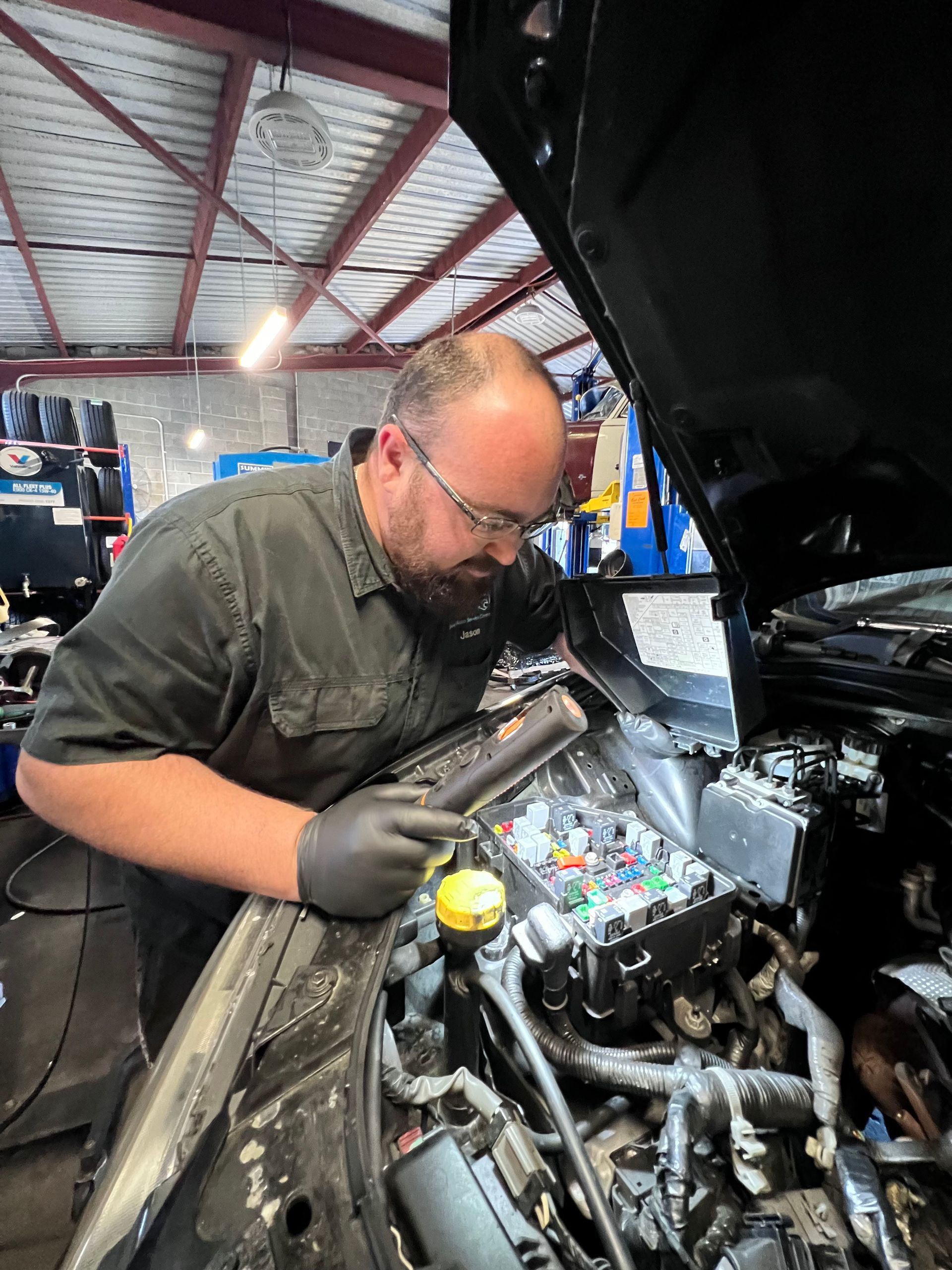 Worker Repairing Vehicle — Joe’s Auto Service Centre in Forster, NSW