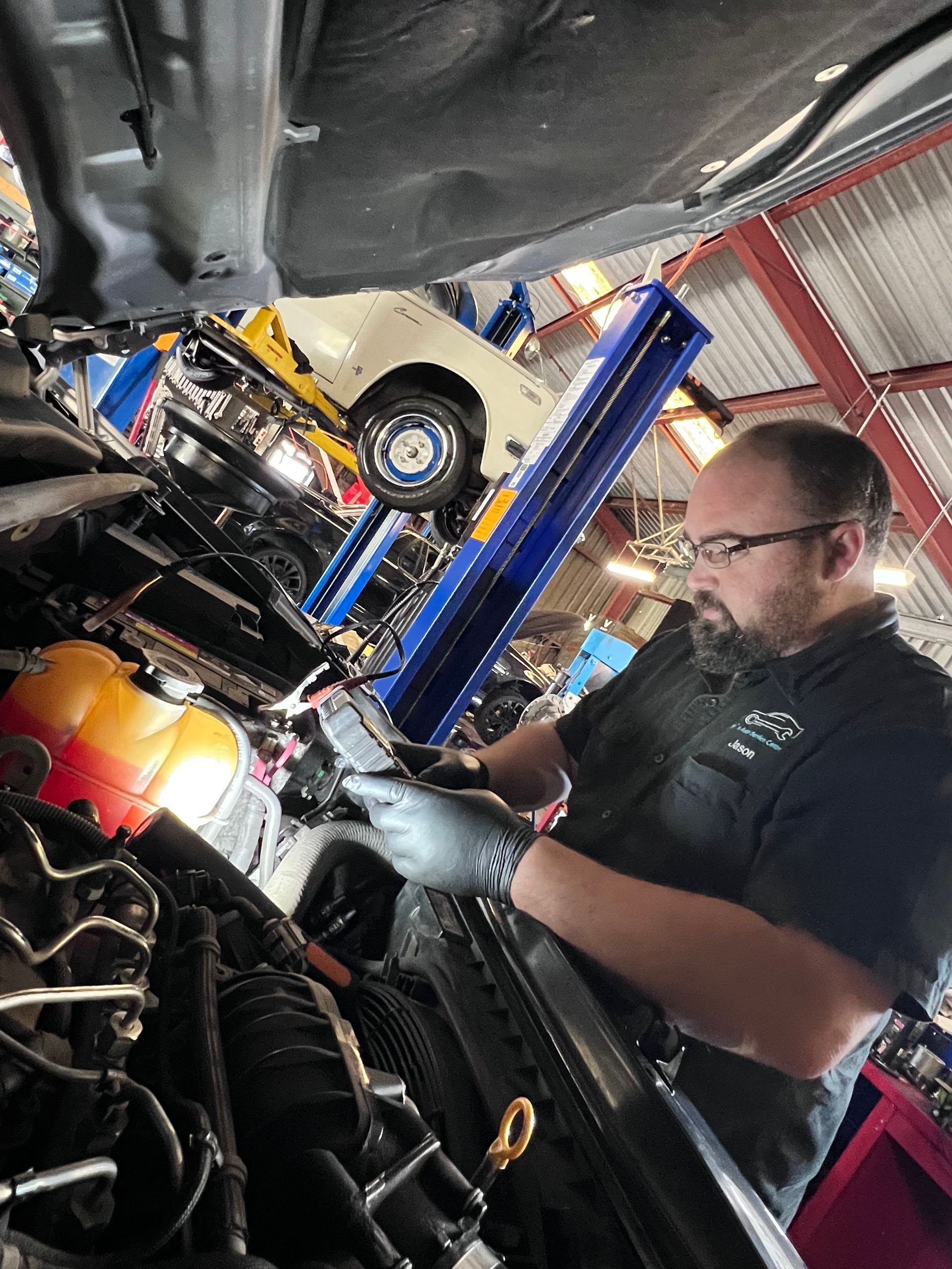 Mechanic Fixing Car at Garage  — Joe’s Auto Service Centre in Forster, NSW