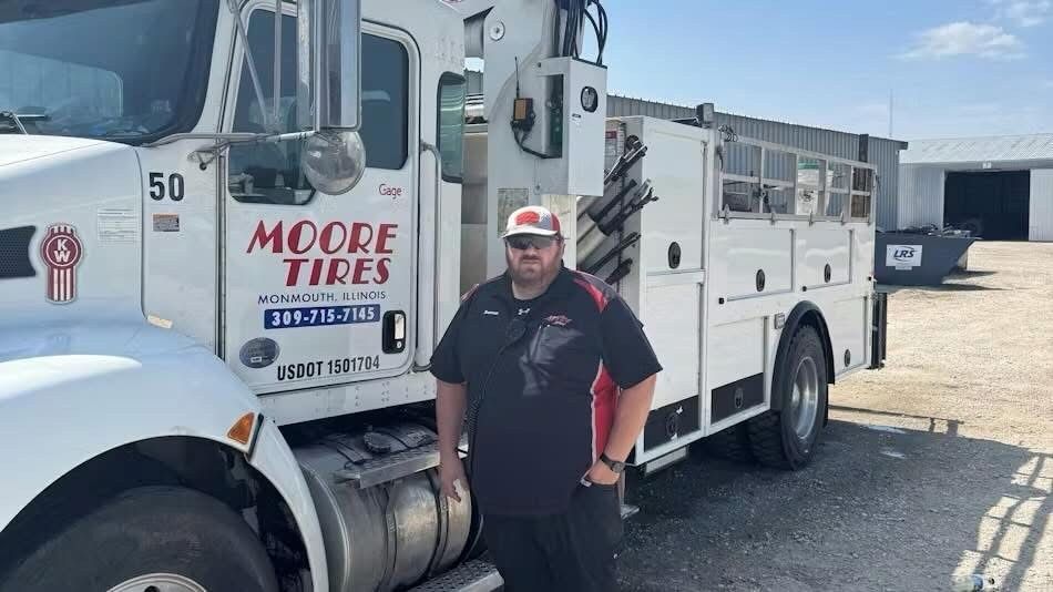 Man in front of a white 