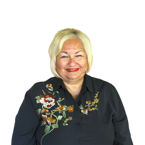 A woman wearing a black shirt with flowers on it
