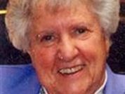 Photo of elderly woman in purple blouse