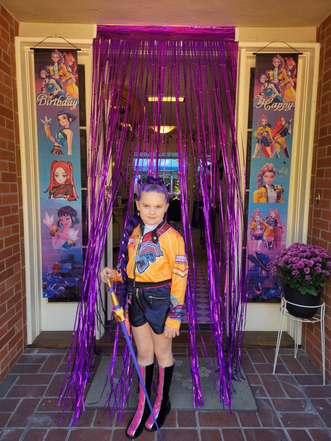 Smiling woman with short, dark hair, in a black top, indoors.