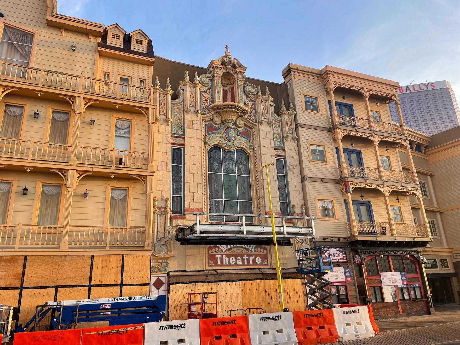 A large building with a sign that says theatre on it.