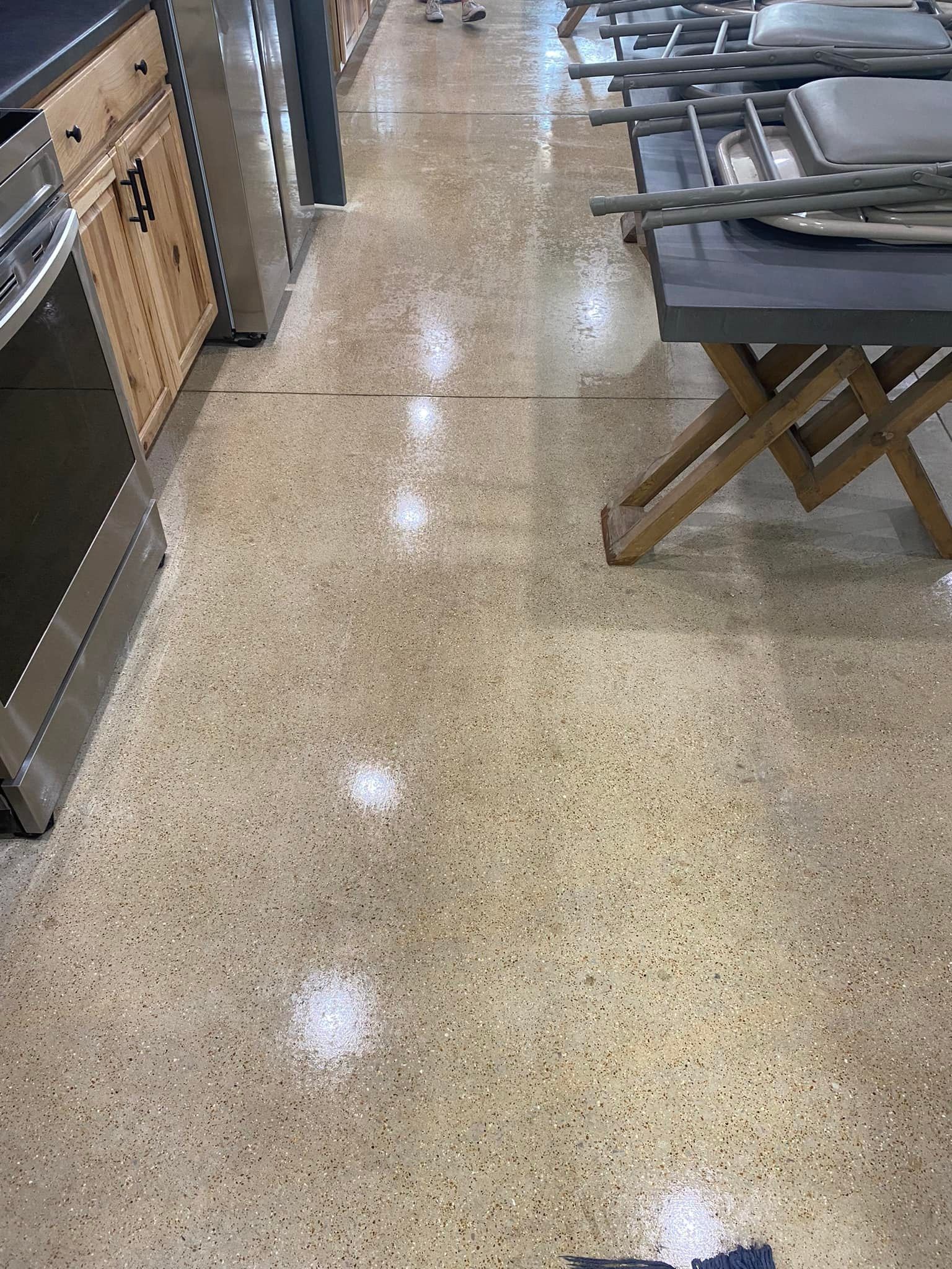 A kitchen with a wooden table and a stove in a store.