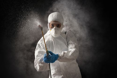 Person in hazmat suit cleaning