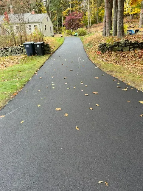 Driveway With Leaves On It - Worcester, MA - Patriot Seal Coating & Paving