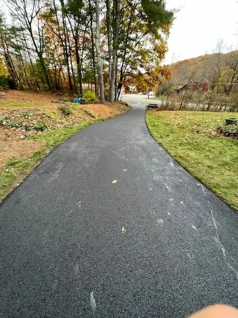 Person Is Standing On The Side Of Road - Worcester, MA - Patriot Seal Coating & Paving