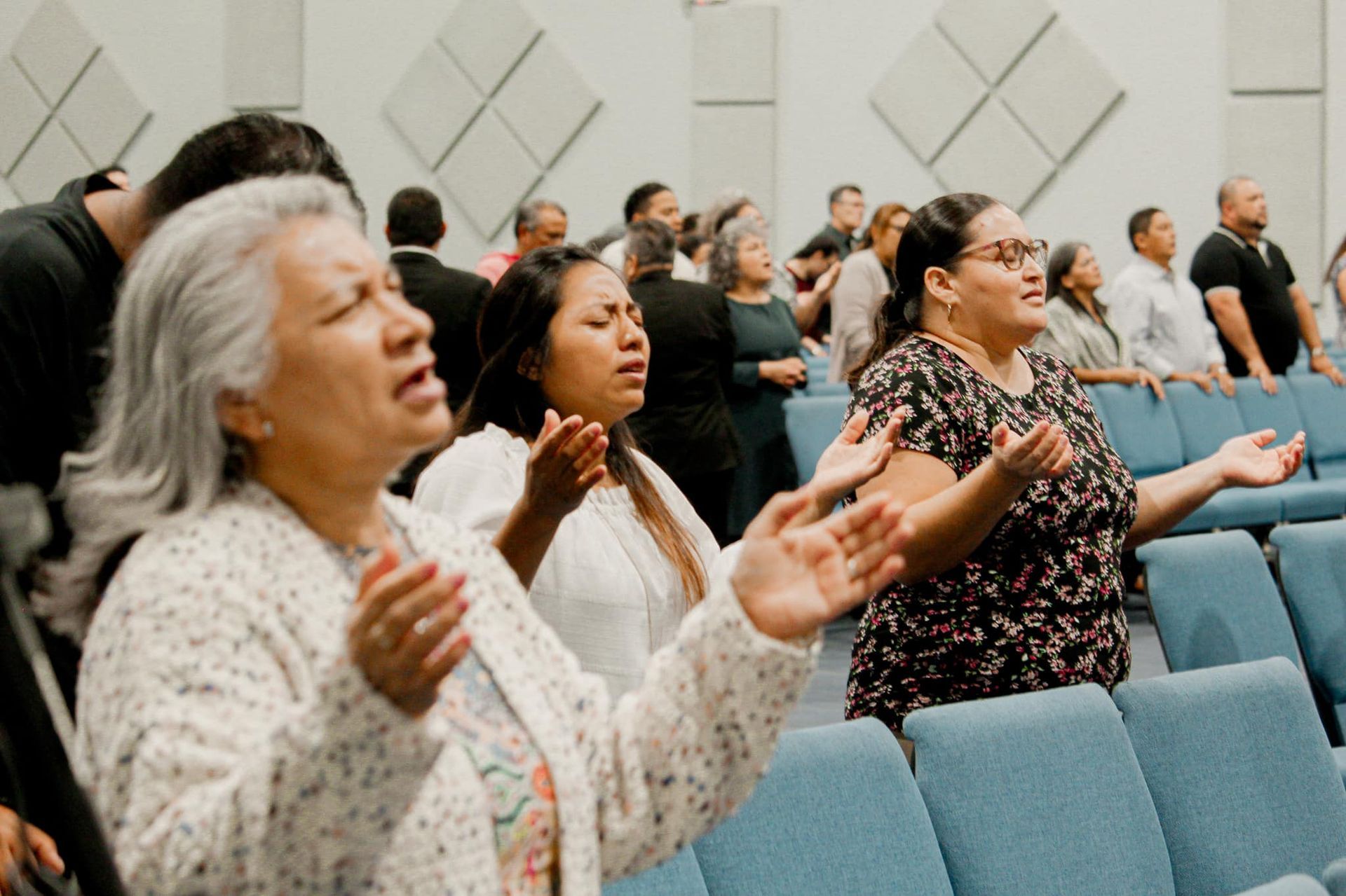 A paper cut out of a family holding hands