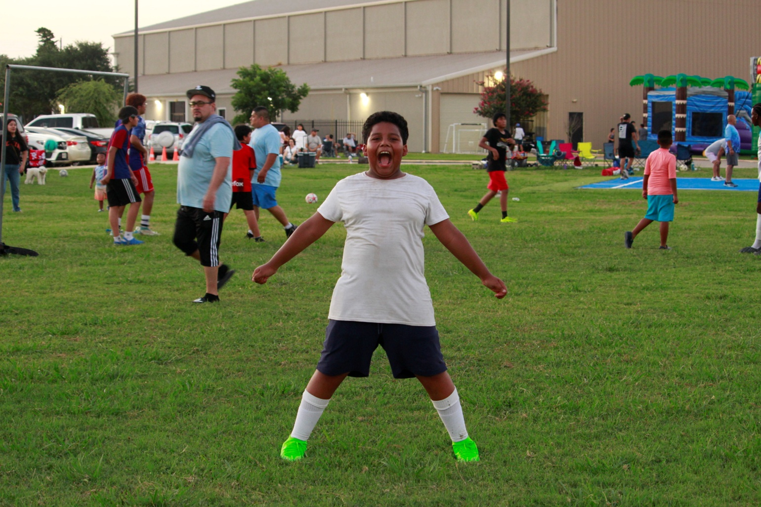A group of people are sitting in a circle holding hands.