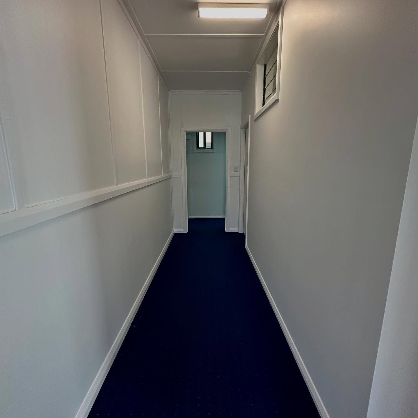 Hallway With Blue Carpet and White Walls — CPAINT In Taree, NSW