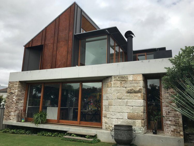 Large House With A Lot Of Windows And A Chimney — CPAINT in Forster, NSW