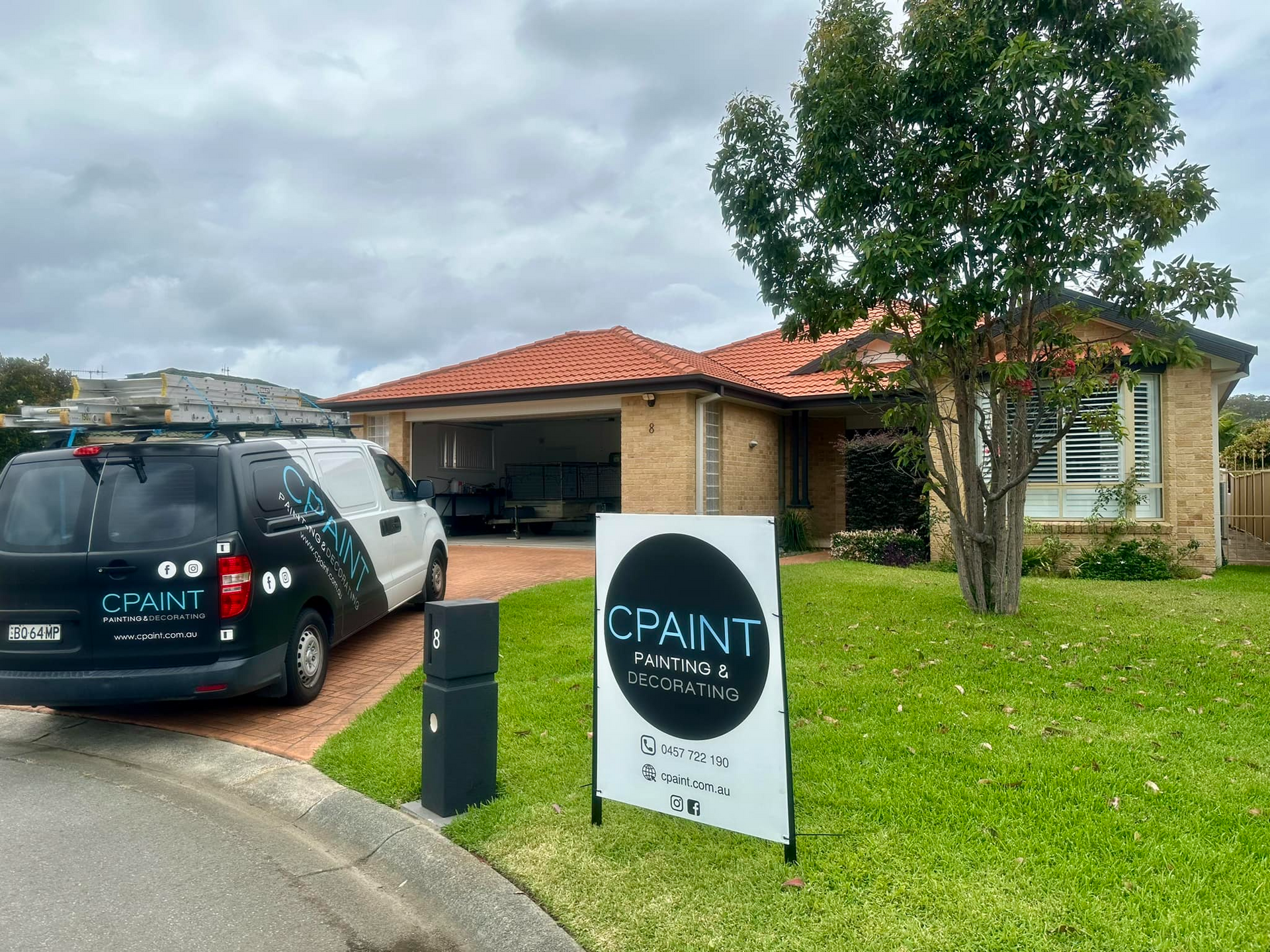 Black and White Van Parked Outside a House — CPAINT in Forster, NSW