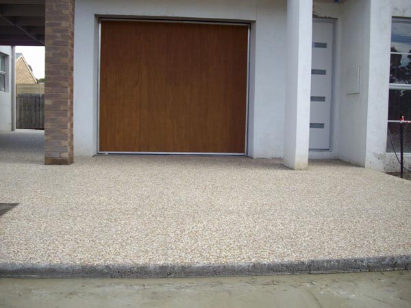 garage with concrete walkways