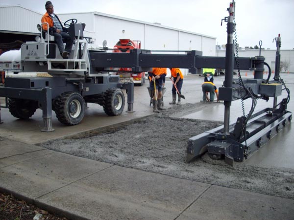 workers laying concrete
