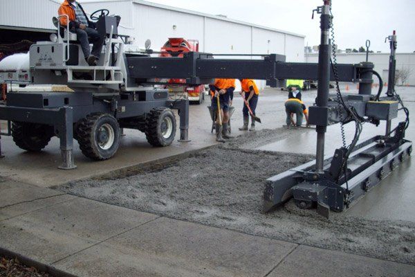 workers laying concrete