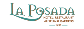 La Posada Winslow Arizona logo with ornate scrolled design above text.