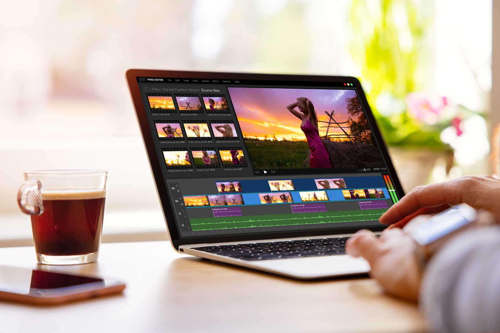 A Virtual Assistant is editing a video on a laptop computer.