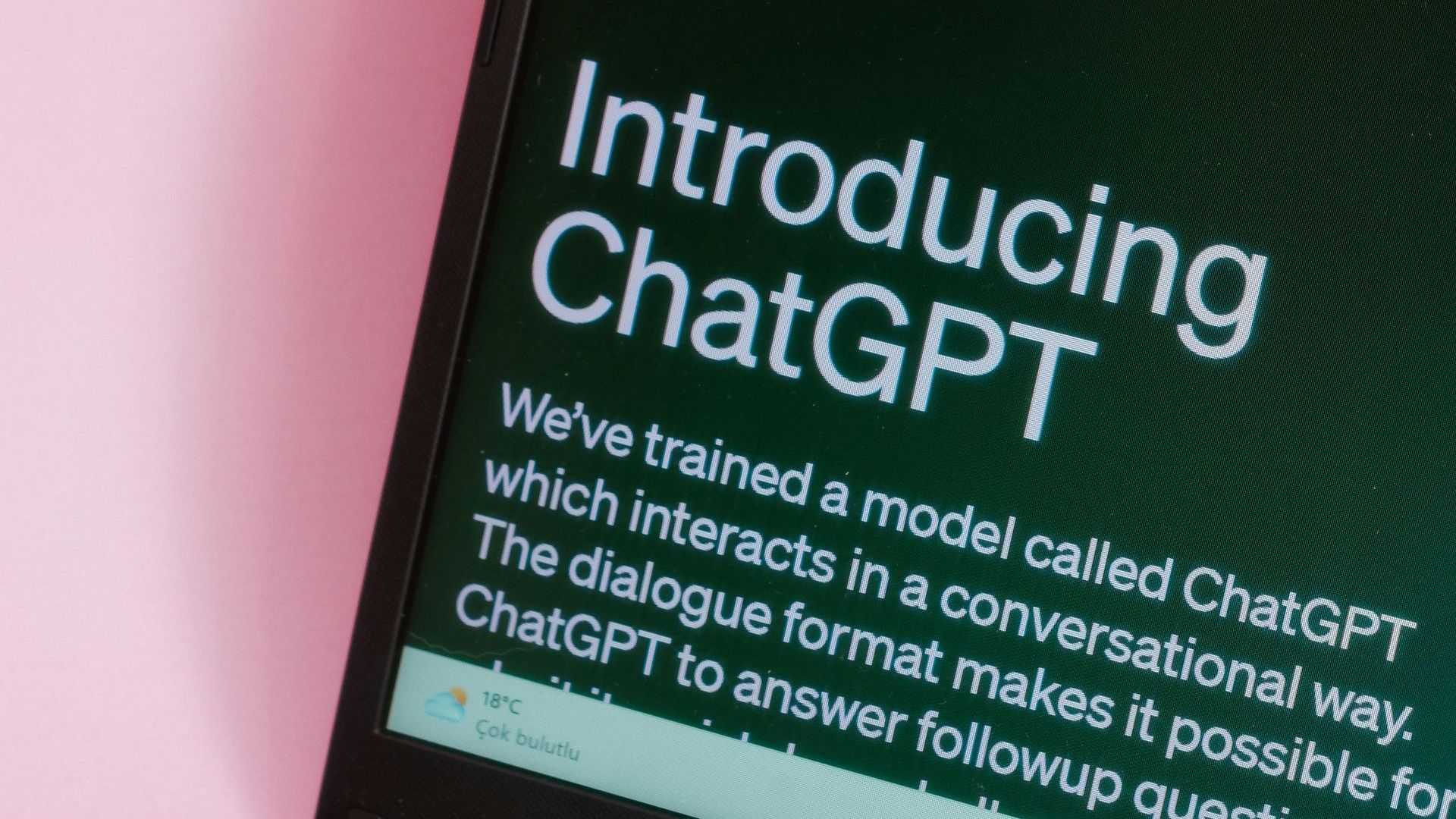 A close up of a phone screen that says introducing chatgpt