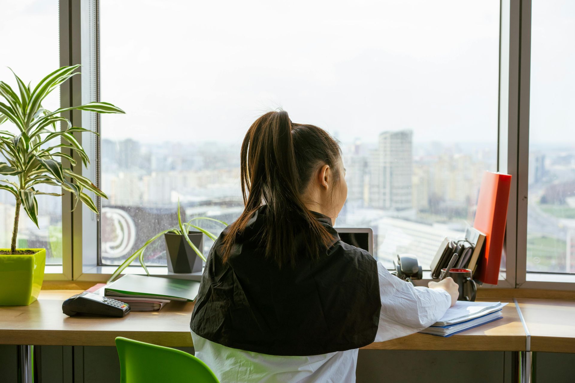 A Virtual Assistant working on a laptop for their client.