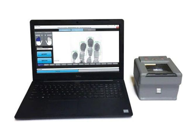 Laptop displaying fingerprints, connected to a fingerprint scanner.