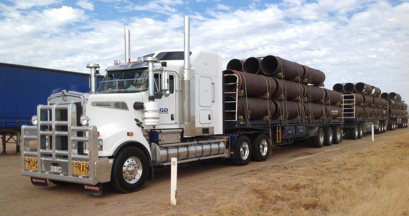 Large Truck Carrying Pipes
