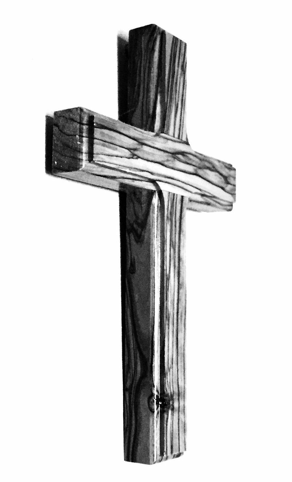 A black and white photo of a wooden cross on a white background.