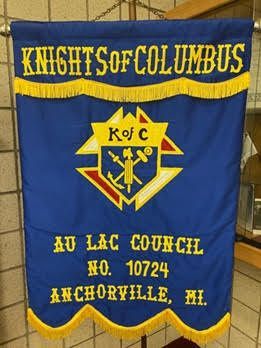 Blue and yellow Knights of Columbus banner for Au Lac Council No. 10724 in Anchorville, Michigan.
