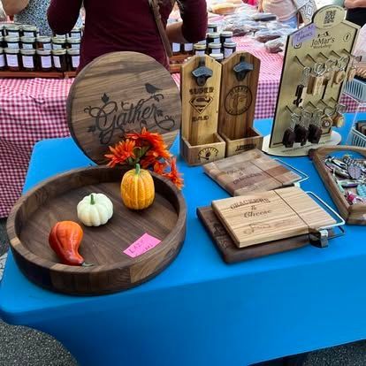 A table with a wooden sign that says gather on it.