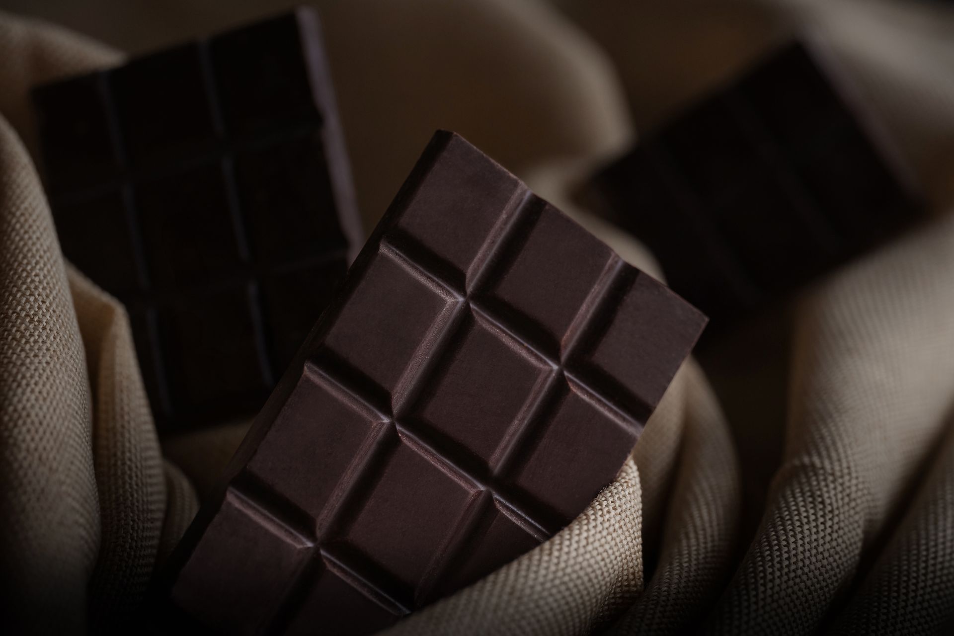A close up of a chocolate bar on a cloth.