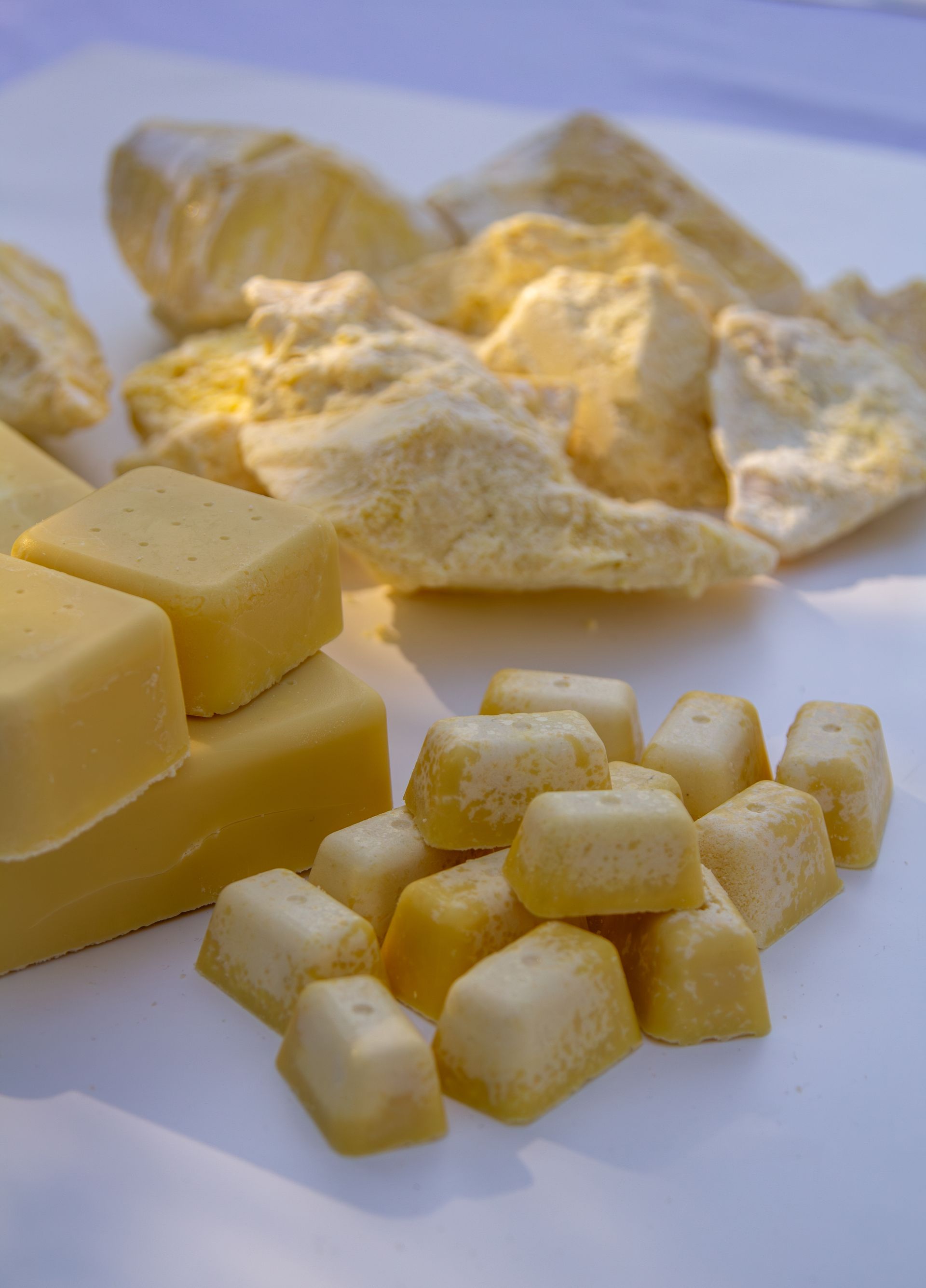 A bunch of yellow pieces of food on a table