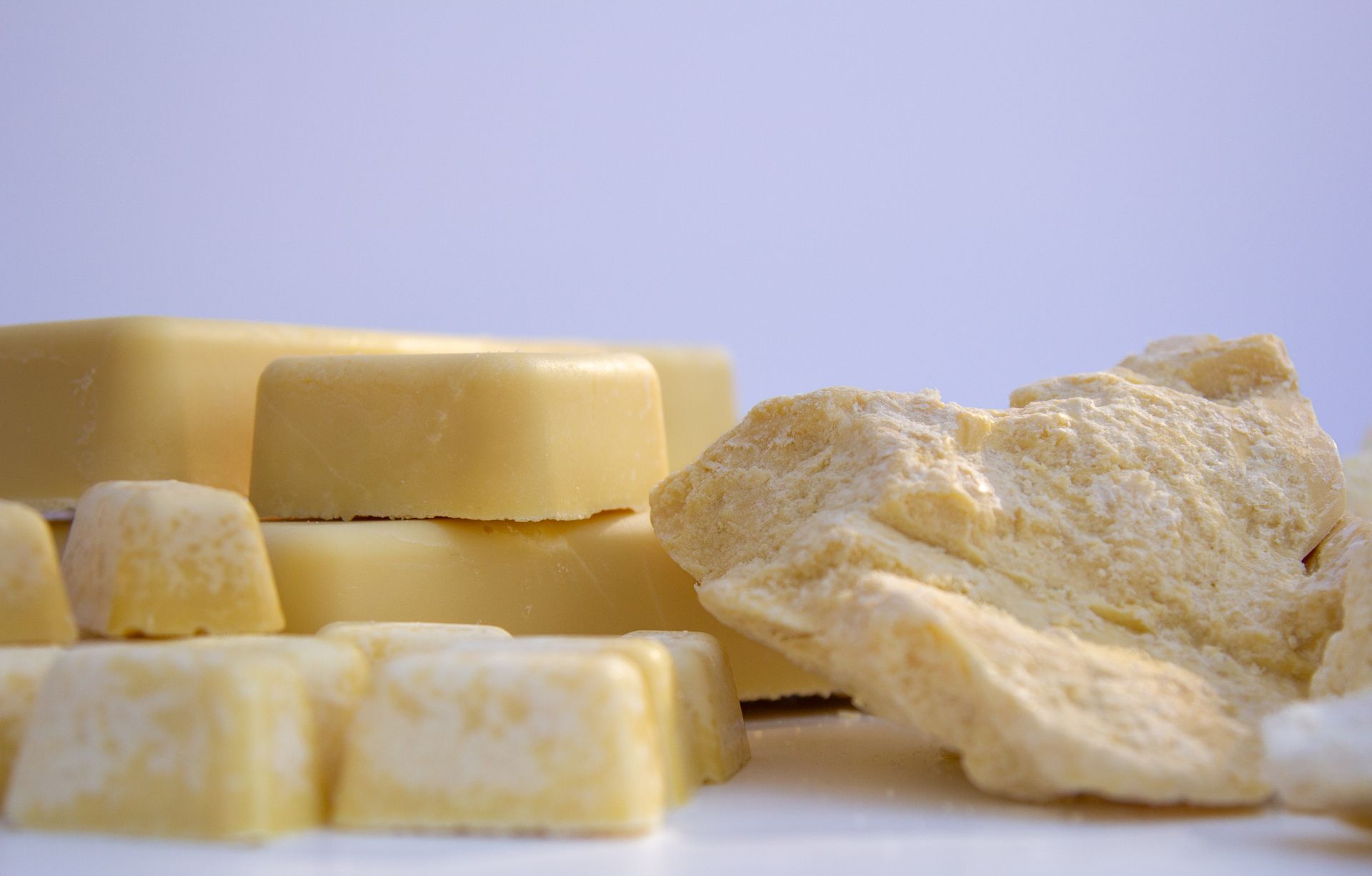 A few pieces of white chocolate are stacked on top of each other