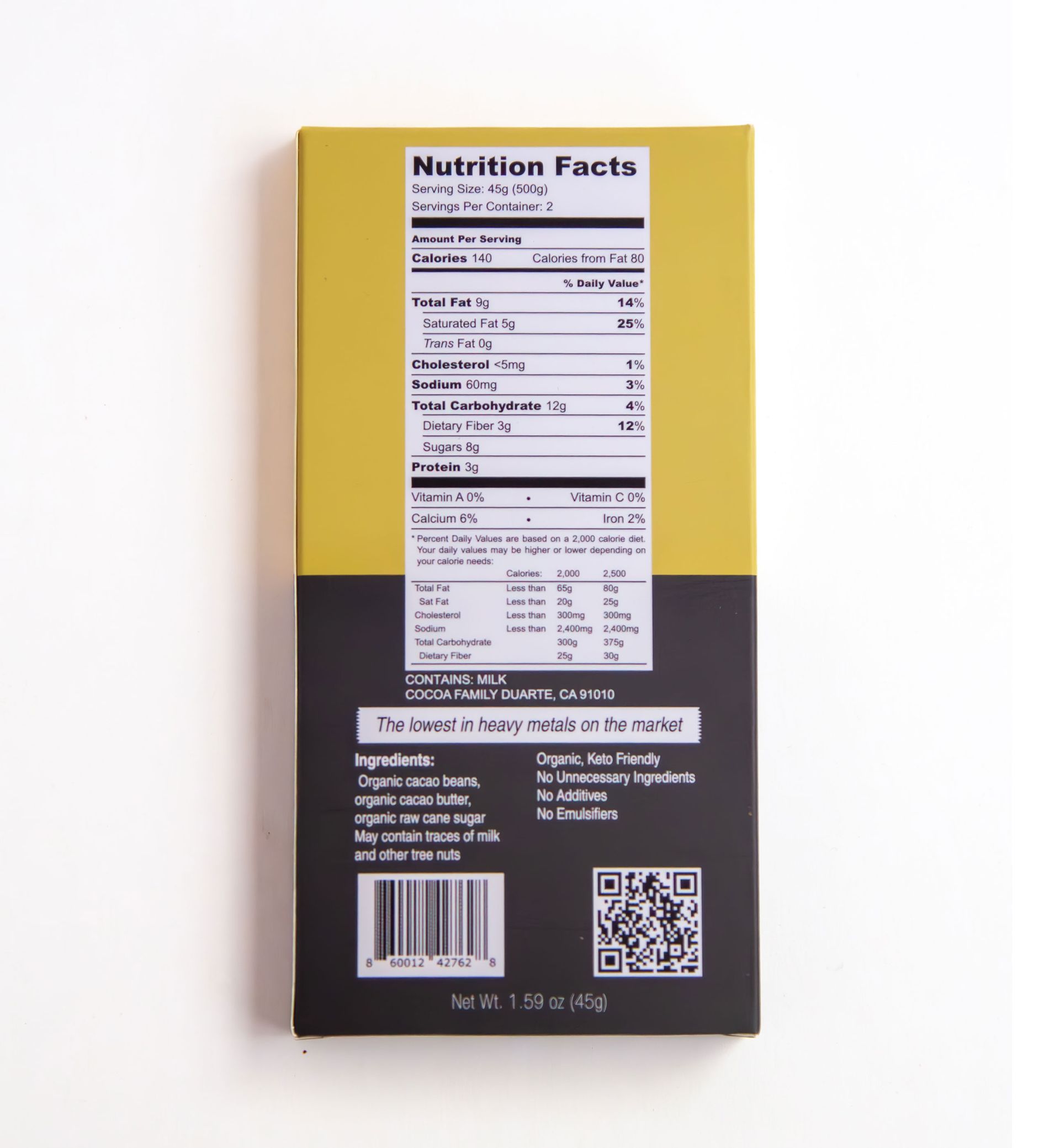 A box of cocoa family 50 % organic cacao sits on a white surface