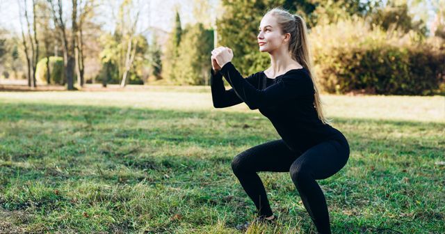 a woman doing a squat
