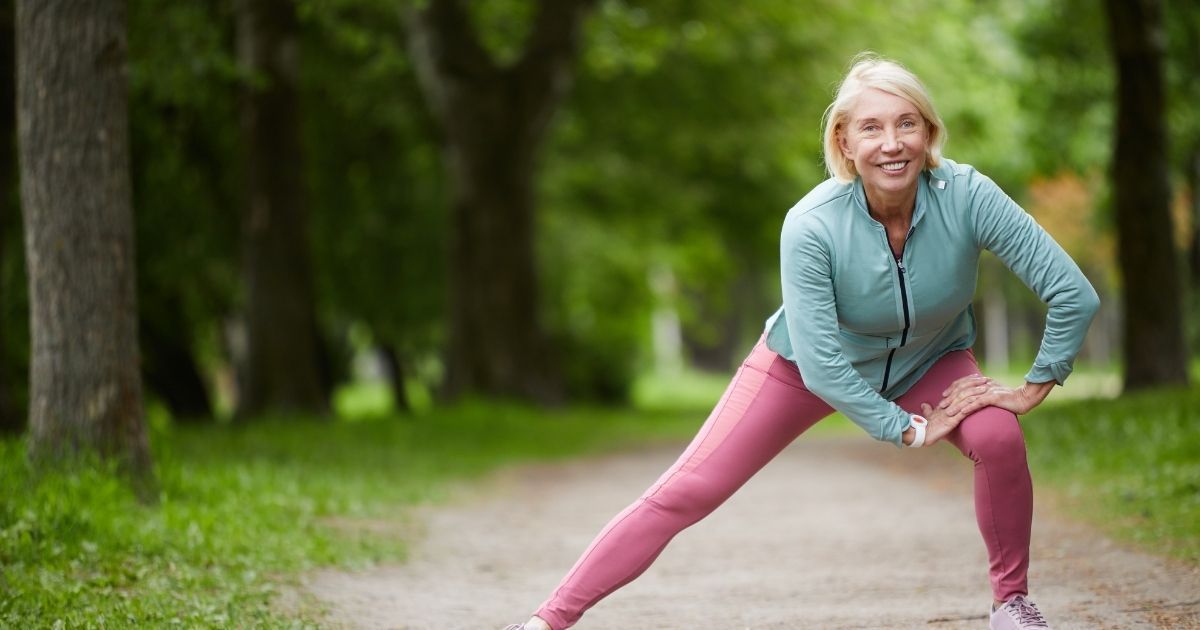 An elderly doing exercise outdoors