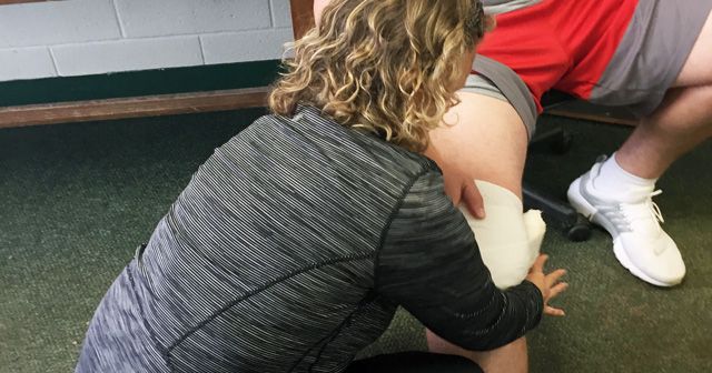 Lauren working on client's knee