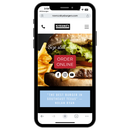 A cell phone with a hamburger and french fries on the screen.