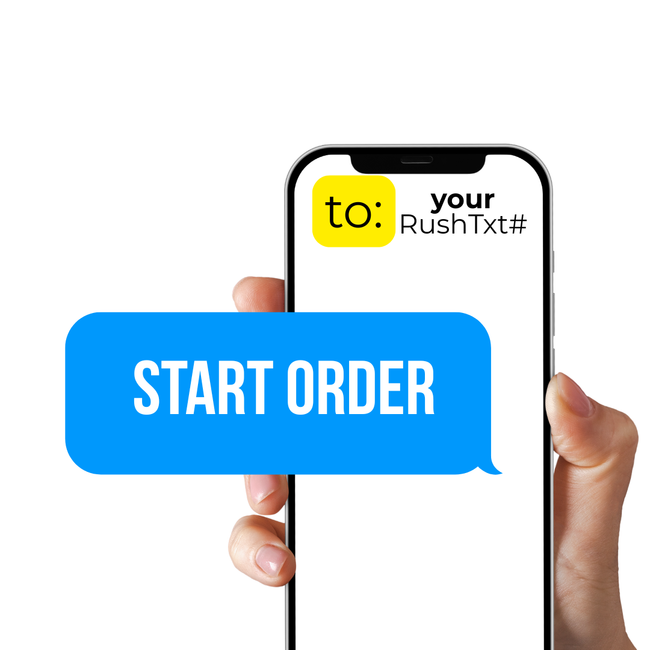 Hand holding a phone with a message: