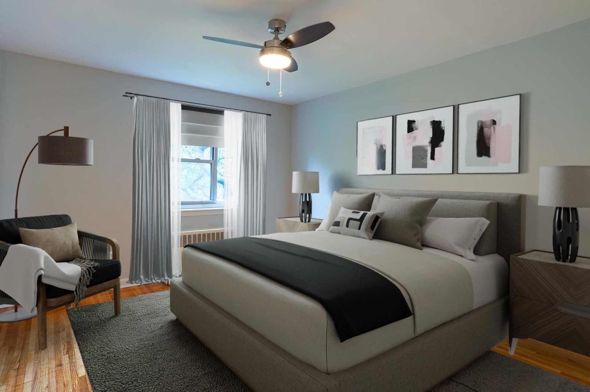 Modern bedroom with large bed, two nightstands, lamps, ceiling fan, and window with sheer curtains.