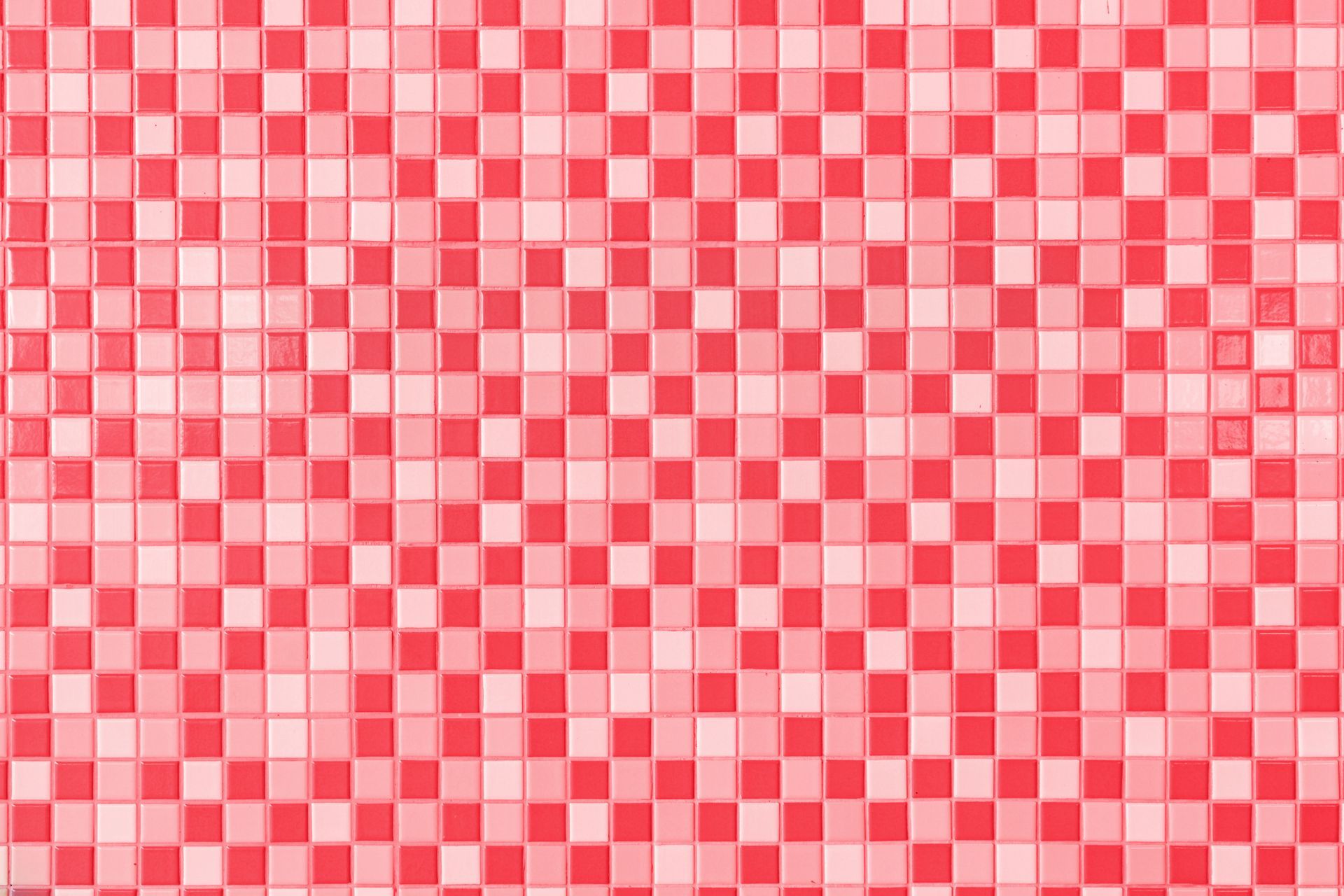 Red and light-red checkered tile pattern, covering a surface.