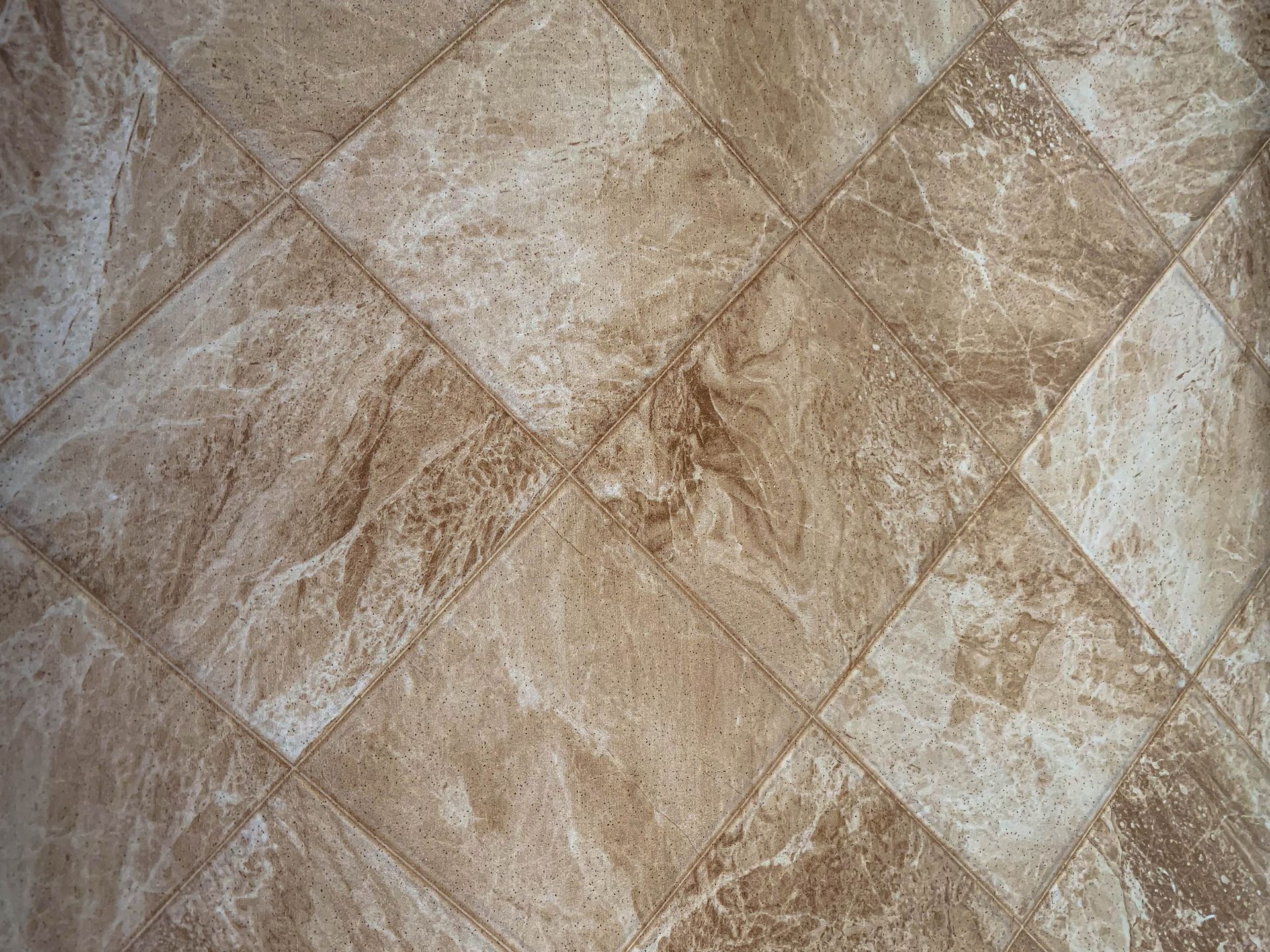 Tan and white diamond-patterned flooring.